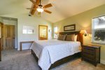 This spacious master bedroom has its own private patio, a TV and a private bathroom with shower.